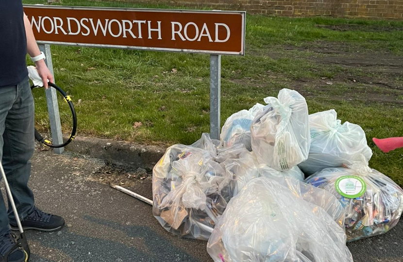 Councillor Adam Hicken with the bags of rubbish that was collected on Poets Corner